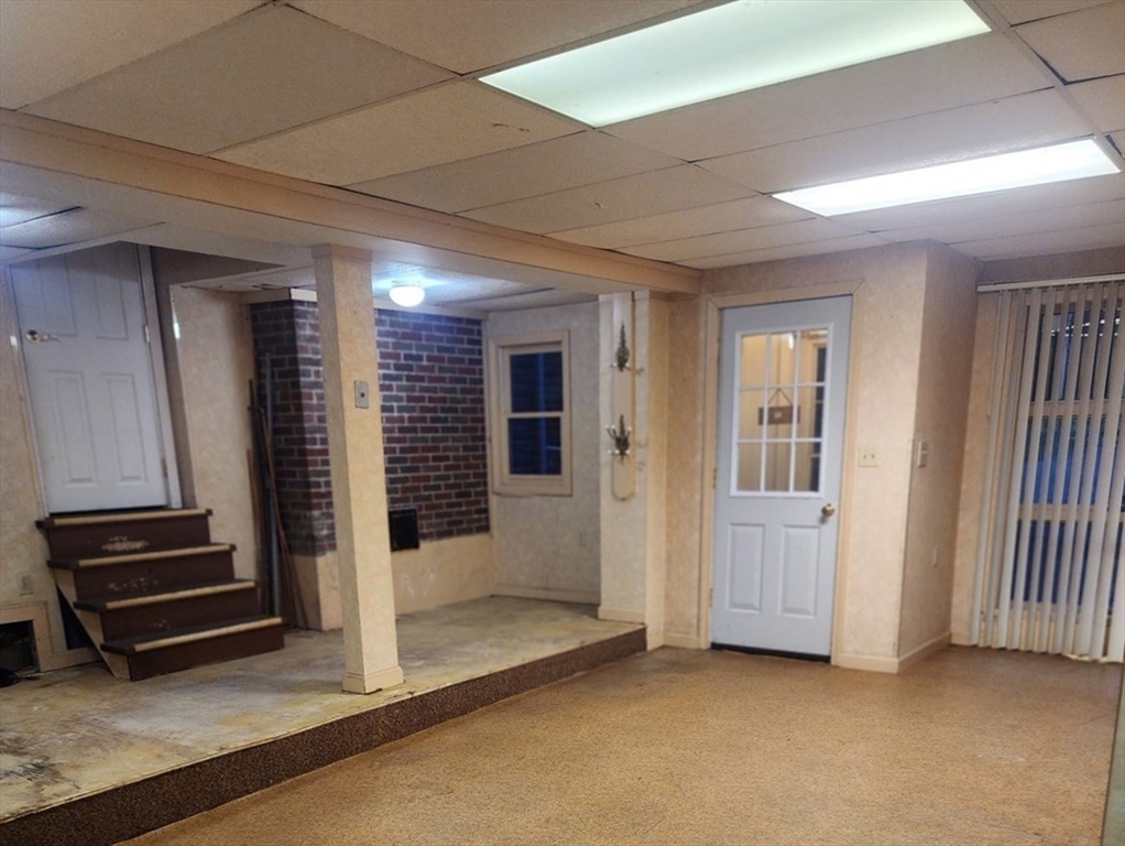 300 Mason Rd Extension Dudley, MA 01571 - Photo 32 of 42 an empty room with wooden floor and windows
