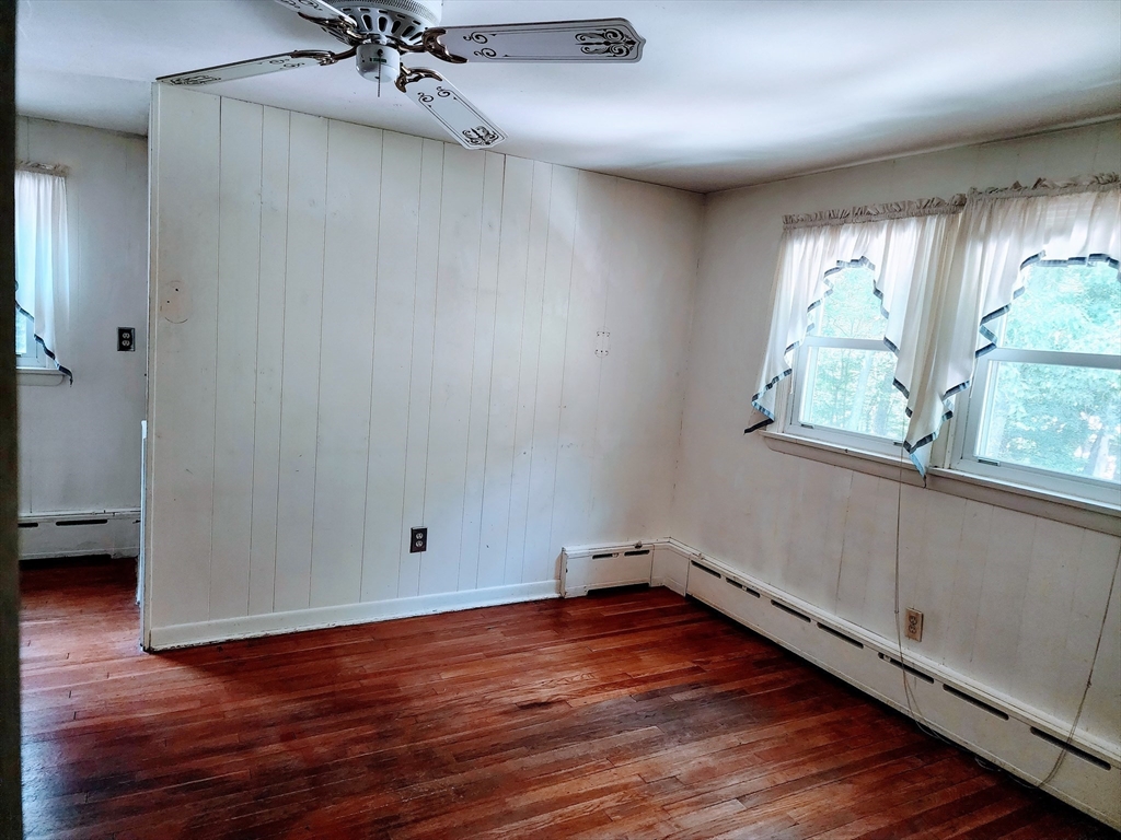 300 Mason Rd Extension Dudley, MA 01571 - Photo 37 of 42 wooden floor in an empty room with a window