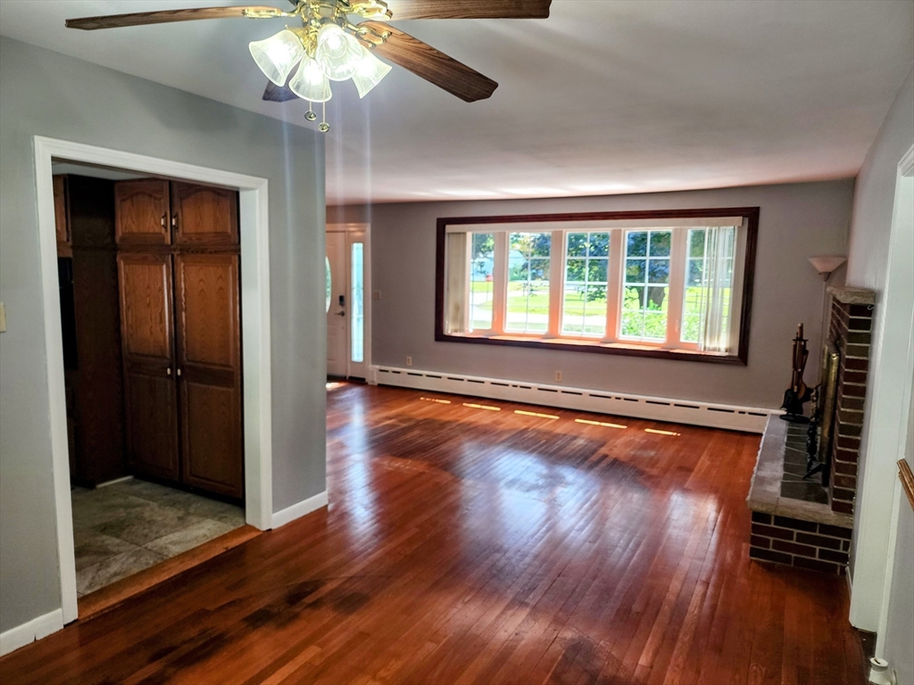 300 Mason Rd Extension Dudley, MA 01571 - Photo 4 of 42 a view of a room with wooden floor and chandelier