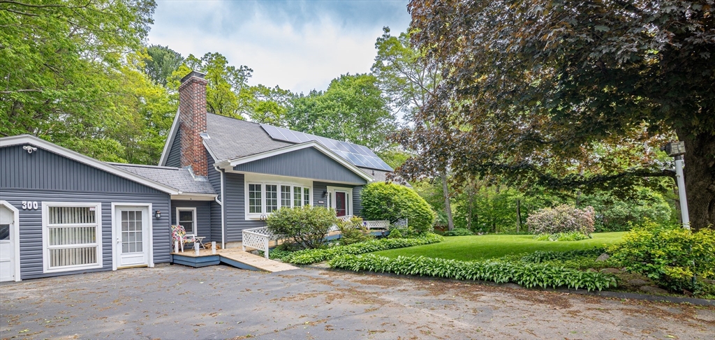 300 Mason Rd Extension Dudley, MA 01571 - Photo 41 of 42 a front view of a house with a garden