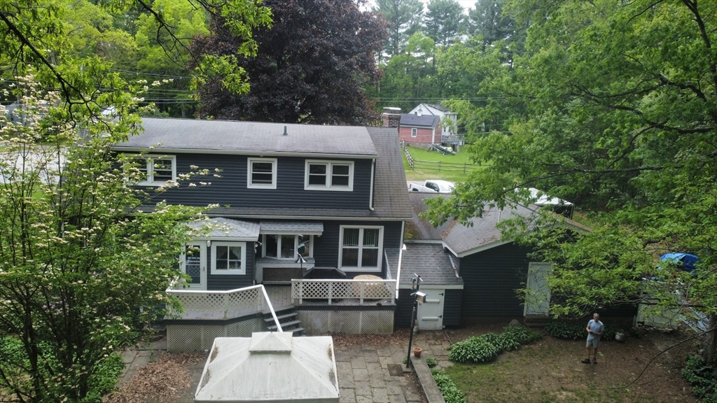 300 Mason Rd Extension Dudley, MA 01571 - Photo 6 of 42 a front view of a house with garden