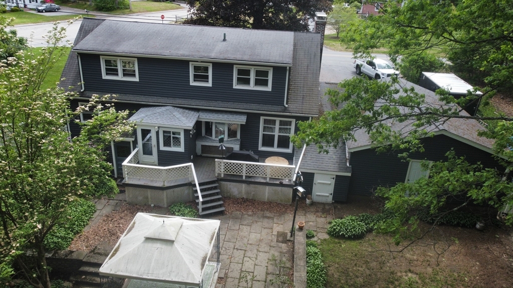300 Mason Rd Extension Dudley, MA 01571 - Photo 7 of 42 a aerial view of a house with a yard and potted plants
