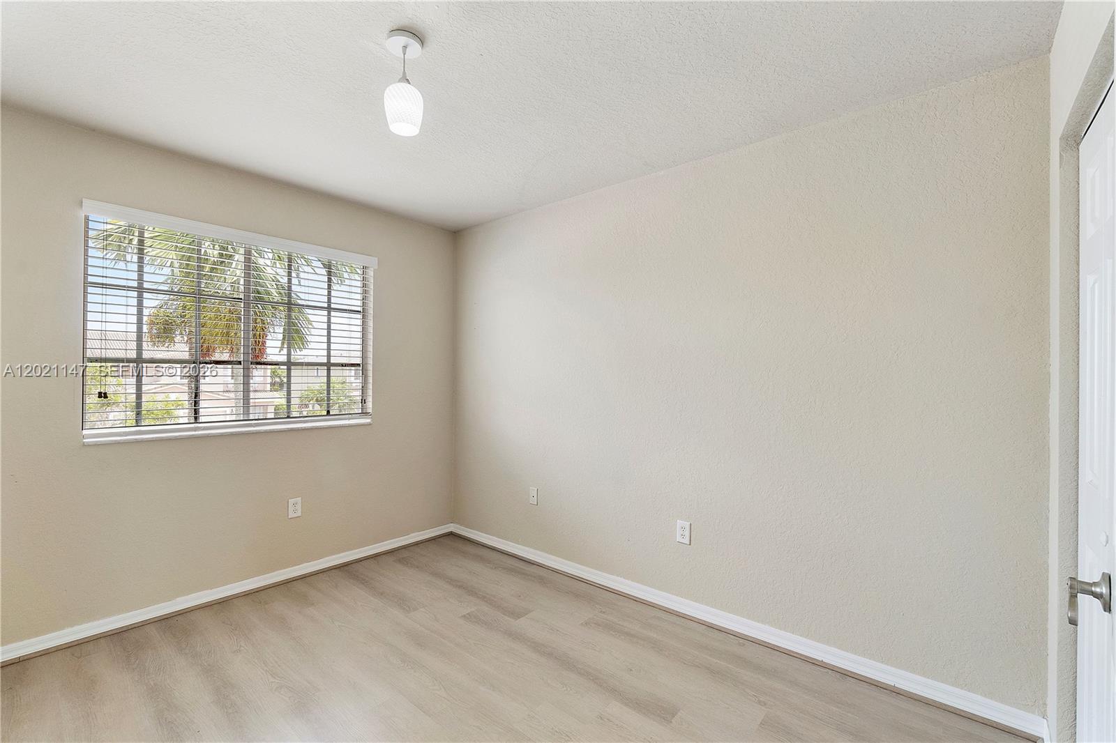 5930 Abbey Road Tamarac, FL 33321 - Photo 10 of 26 an empty room with a window