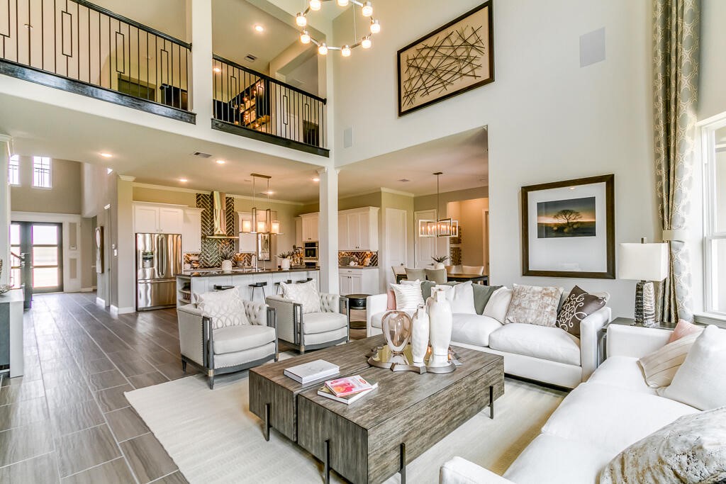 19934 Alondra Way Cypress, TX 77433 - Photo 3 of 11 a living room with furniture and a dining table with wooden floor