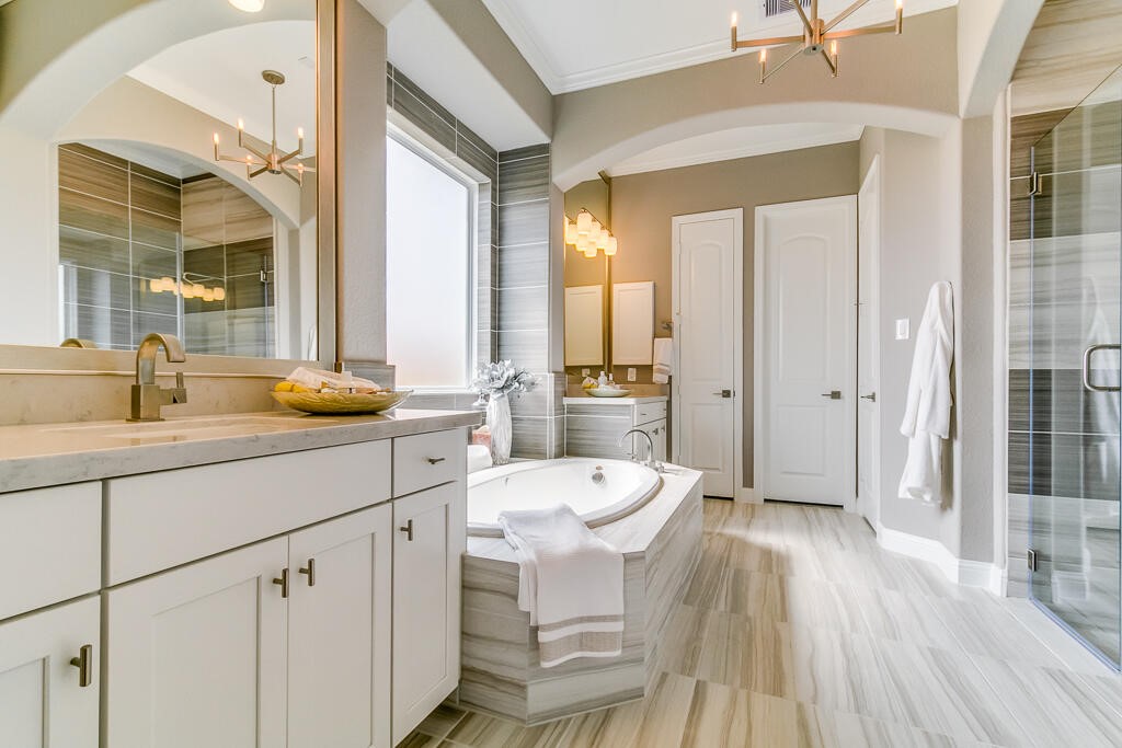 19934 Alondra Way Cypress, TX 77433 - Photo 5 of 11 a spacious bathroom with a sink a toilet a mirror and shower