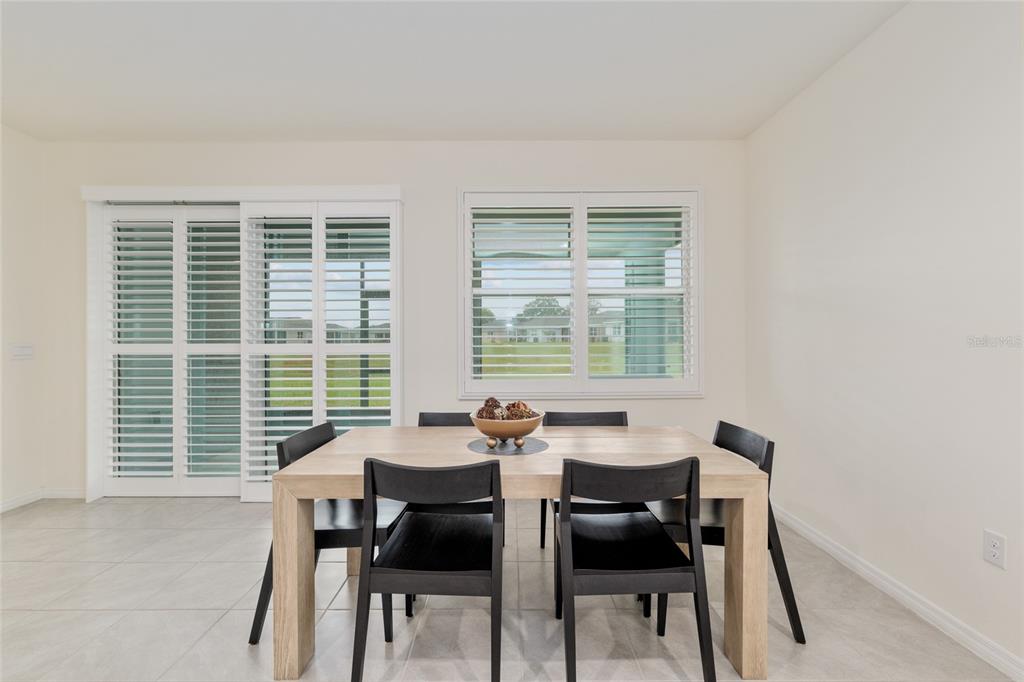 5246 Northwest 43rd Ln Road Ocala, FL 34482 - Photo 16 of 84 a dining room with a table and chairs