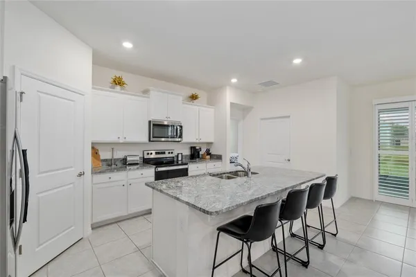 a bedroom with a bed and a couch