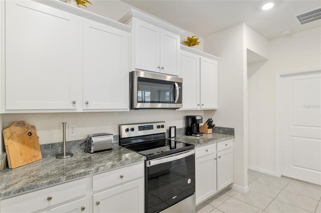 5246 Northwest 43rd Ln Road Ocala, FL 34482 - Photo 21 of 84 a kitchen with appliances a sink and cabinets