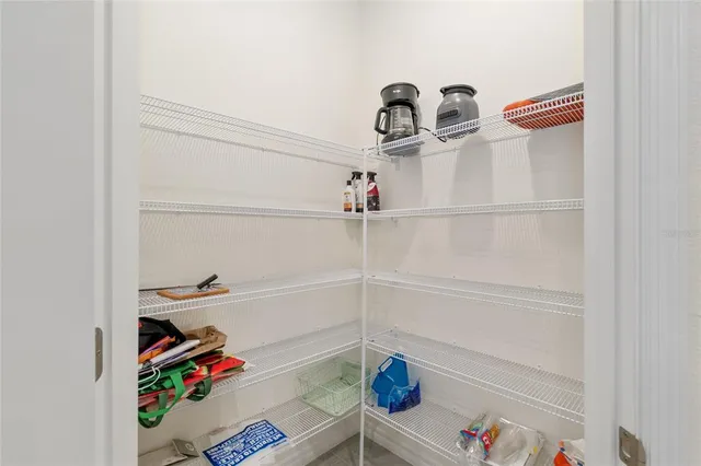 a bedroom with a bed and a night stand