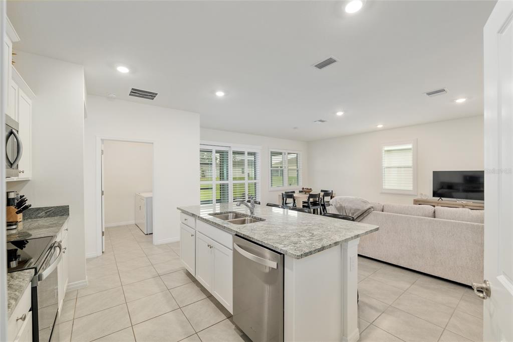 5246 Northwest 43rd Ln Road Ocala, FL 34482 - Photo 25 of 84 a kitchen with a sink stove and refrigerator