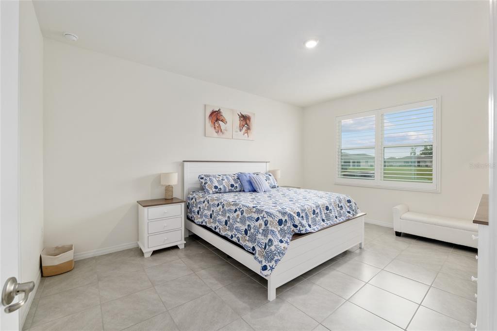 5246 Northwest 43rd Ln Road Ocala, FL 34482 - Photo 26 of 84 a bedroom with a bed and a window