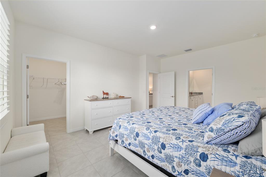 5246 Northwest 43rd Ln Road Ocala, FL 34482 - Photo 28 of 84 a bedroom with a bed and a couch