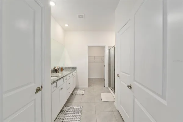 a view of a city from a balcony with furniture