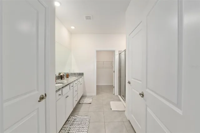 a view of a city from a balcony with furniture