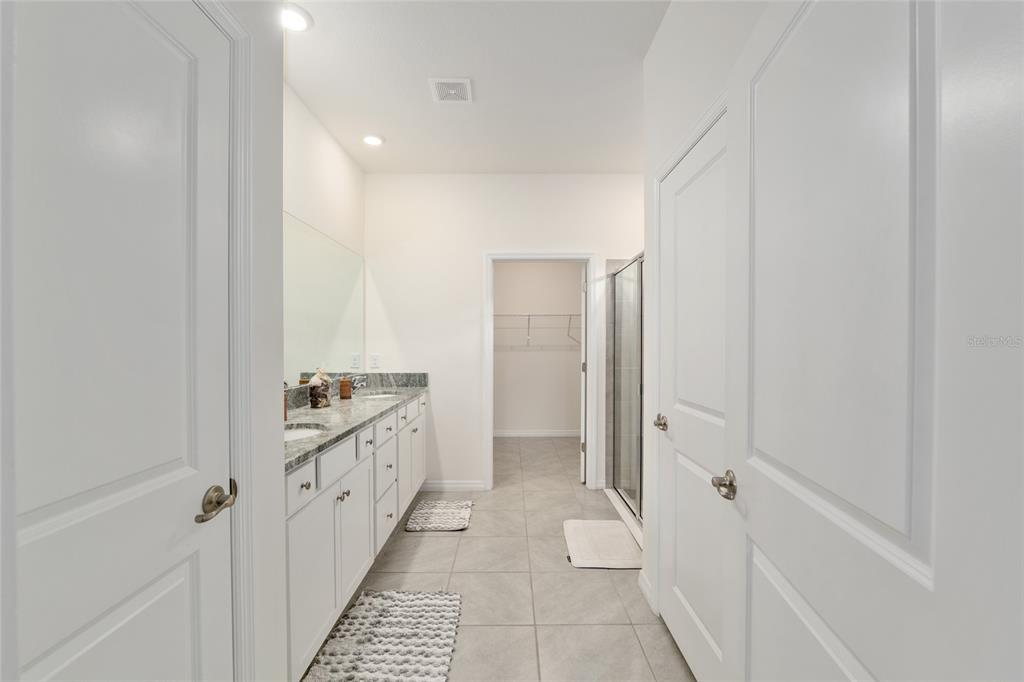 5246 Northwest 43rd Ln Road Ocala, FL 34482 - Photo 29 of 84 a bathroom with a sink and a mirror