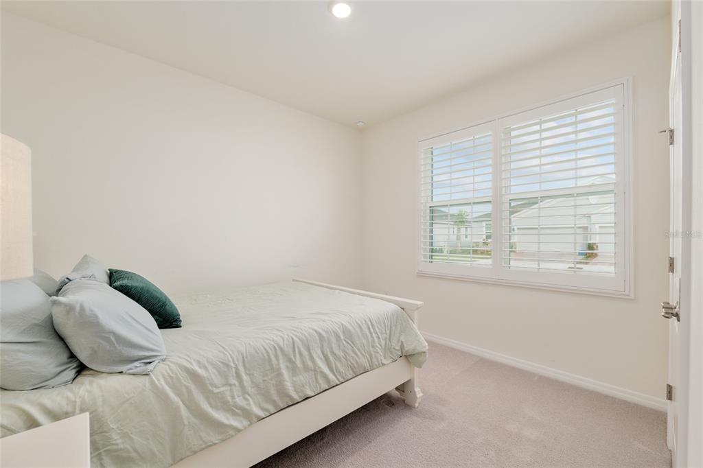 5246 Northwest 43rd Ln Road Ocala, FL 34482 - Photo 37 of 84 a bedroom with a bed and a window