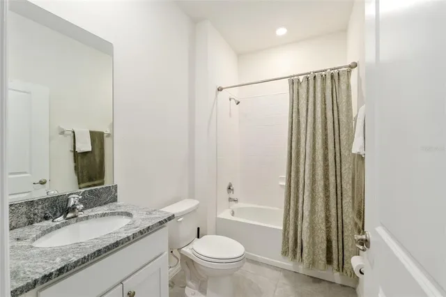 a view of a patio with table and chairs and potted plants