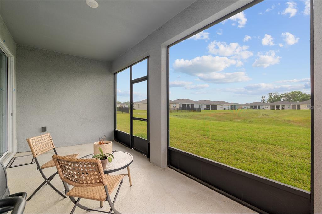 5246 Northwest 43rd Ln Road Ocala, FL 34482 - Photo 47 of 84 a view of a city from a balcony with furniture