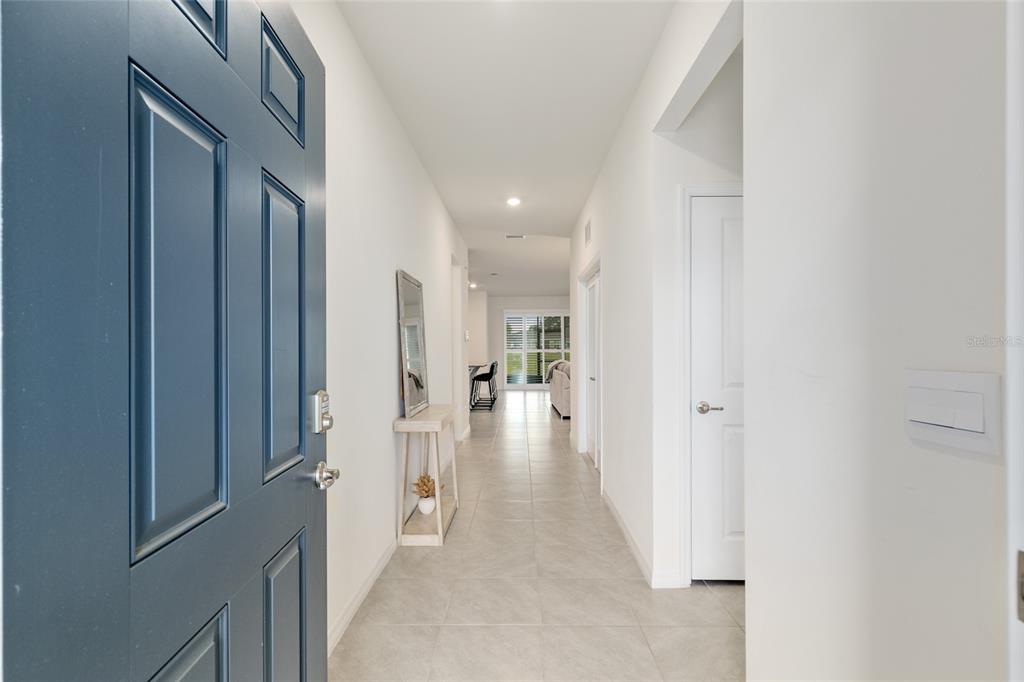 5246 Northwest 43rd Ln Road Ocala, FL 34482 - Photo 6 of 84 a view of a hallway with wooden floor and closet