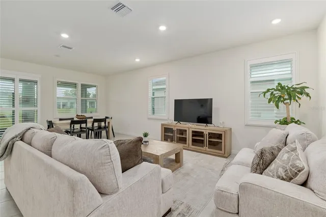 a living room with furniture and a table