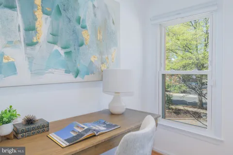 a bedroom with a bed and a lamp