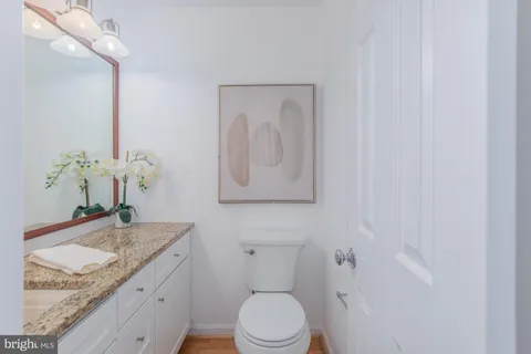 a bedroom with a bed and a mirror