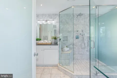 a bathroom with a shower curtain and a sink