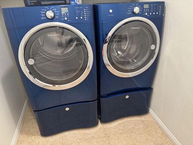 a kitchen with granite countertop a sink a stove and cabinets