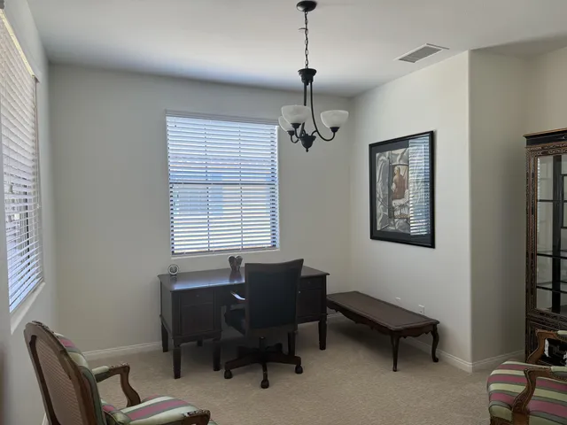 a bedroom with a bed and a ceiling fan