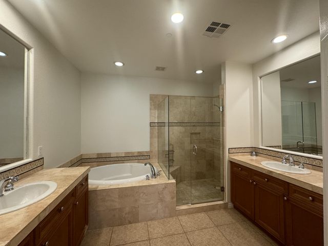 a bathroom with a glass shower door