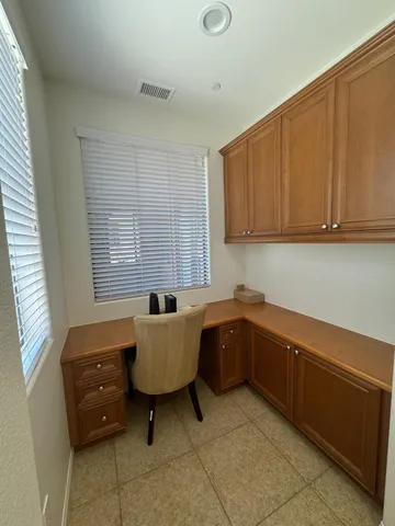 a bathroom with a granite countertop sink a toilet and a mirror