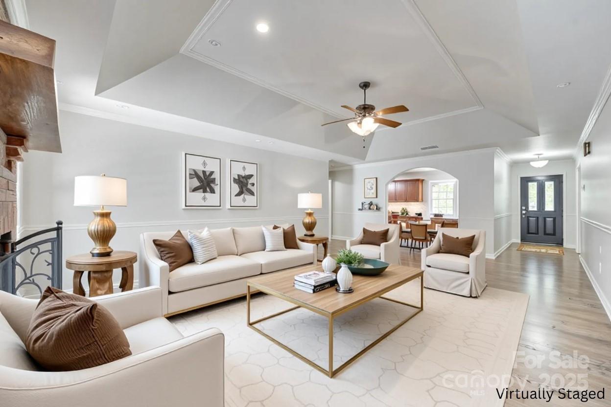 4307 Edgeland Road Edgemoor, SC 29712 - Photo 11 of 48 a living room with furniture a table and a chandelier