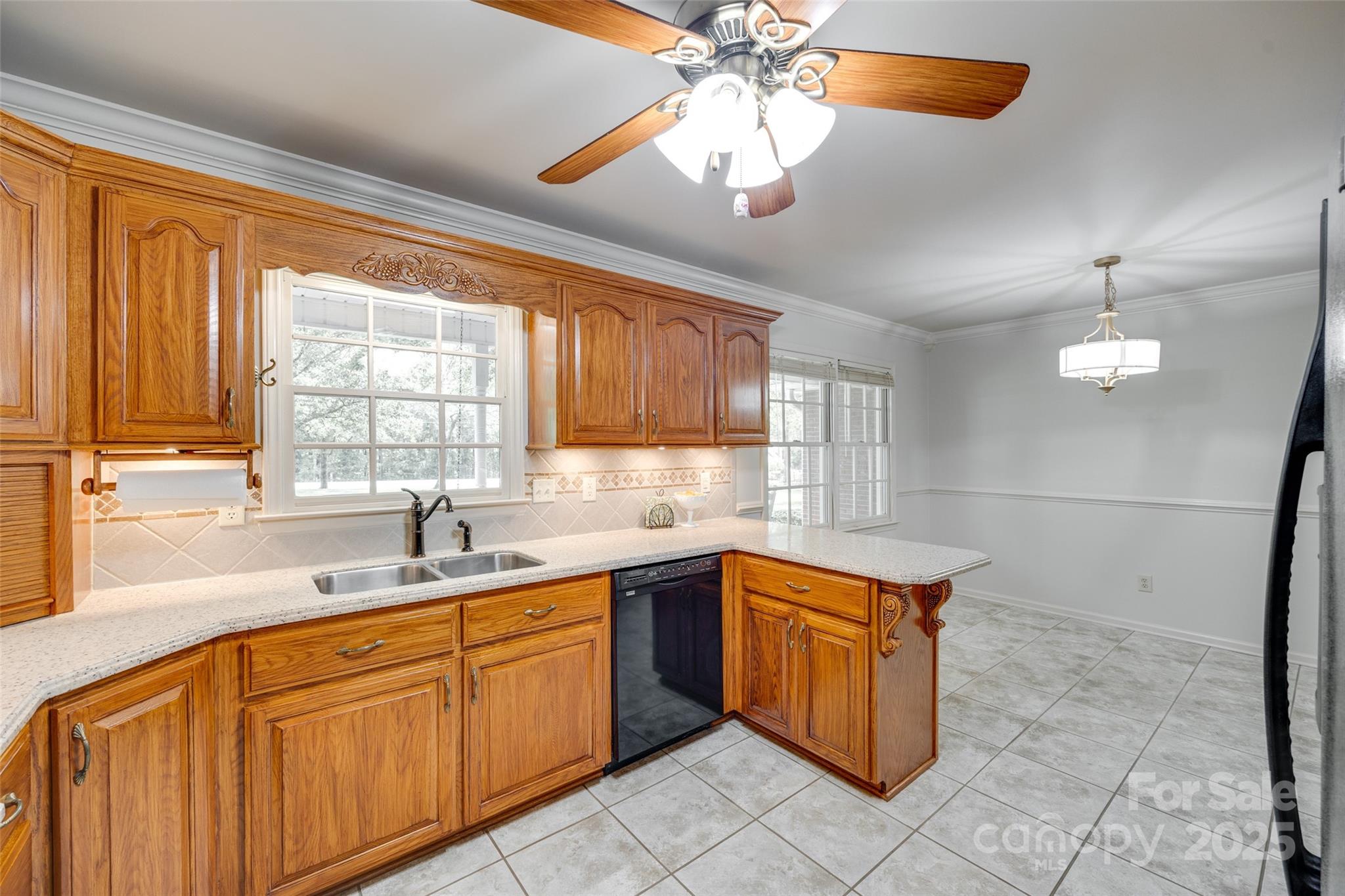 4307 Edgeland Road Edgemoor, SC 29712 - Photo 15 of 48 a kitchen with a sink stove and cabinets