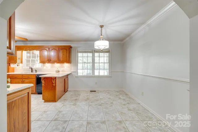 a spacious bathroom with a granite countertop sink a mirror and a bathtub