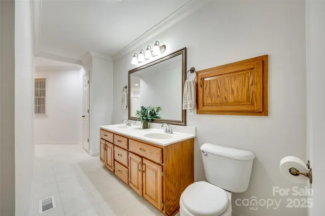 a bathroom with a sink a toilet and a shower