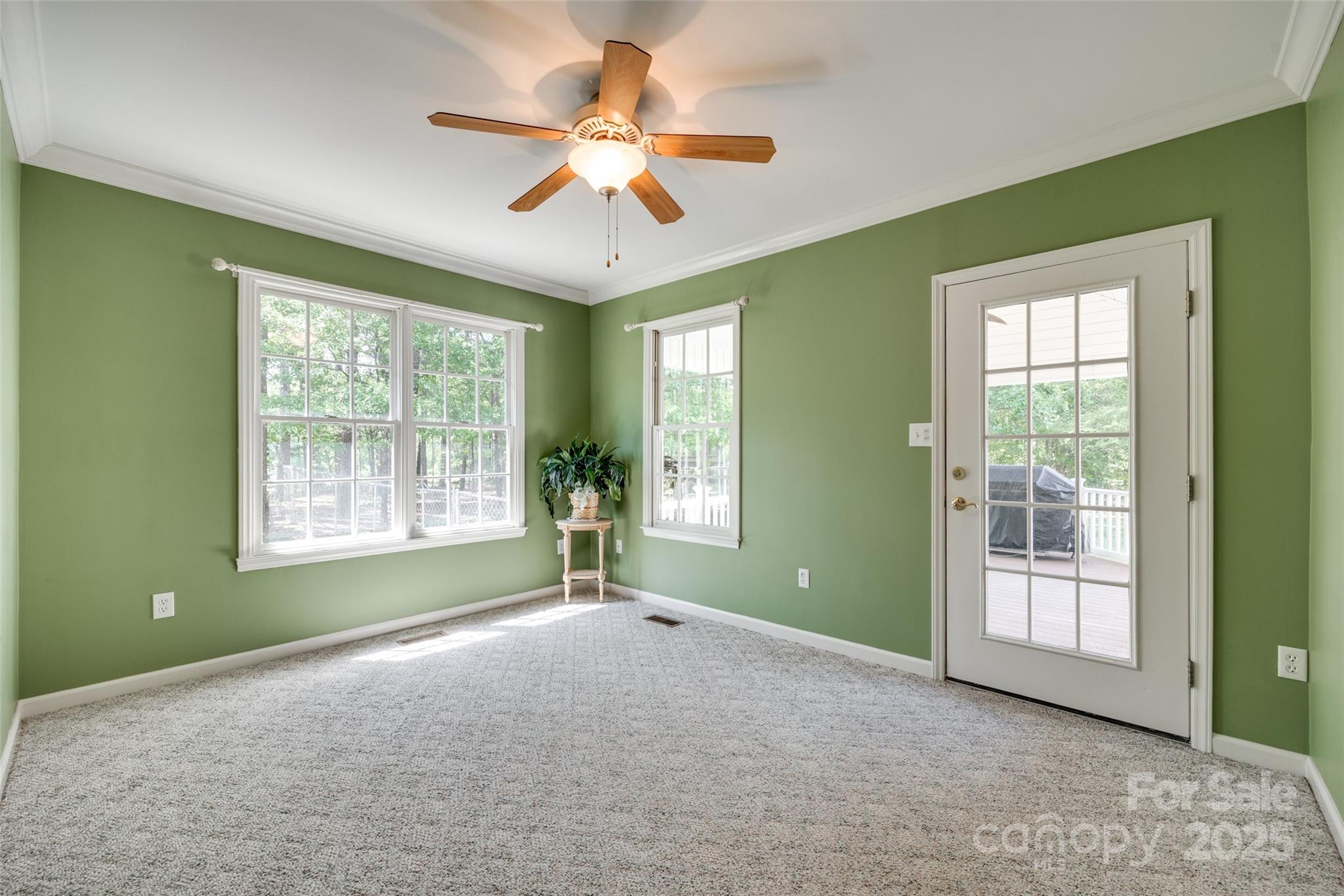 4307 Edgeland Road Edgemoor, SC 29712 - Photo 32 of 48 a view of livingroom with window ceiling fan and front door