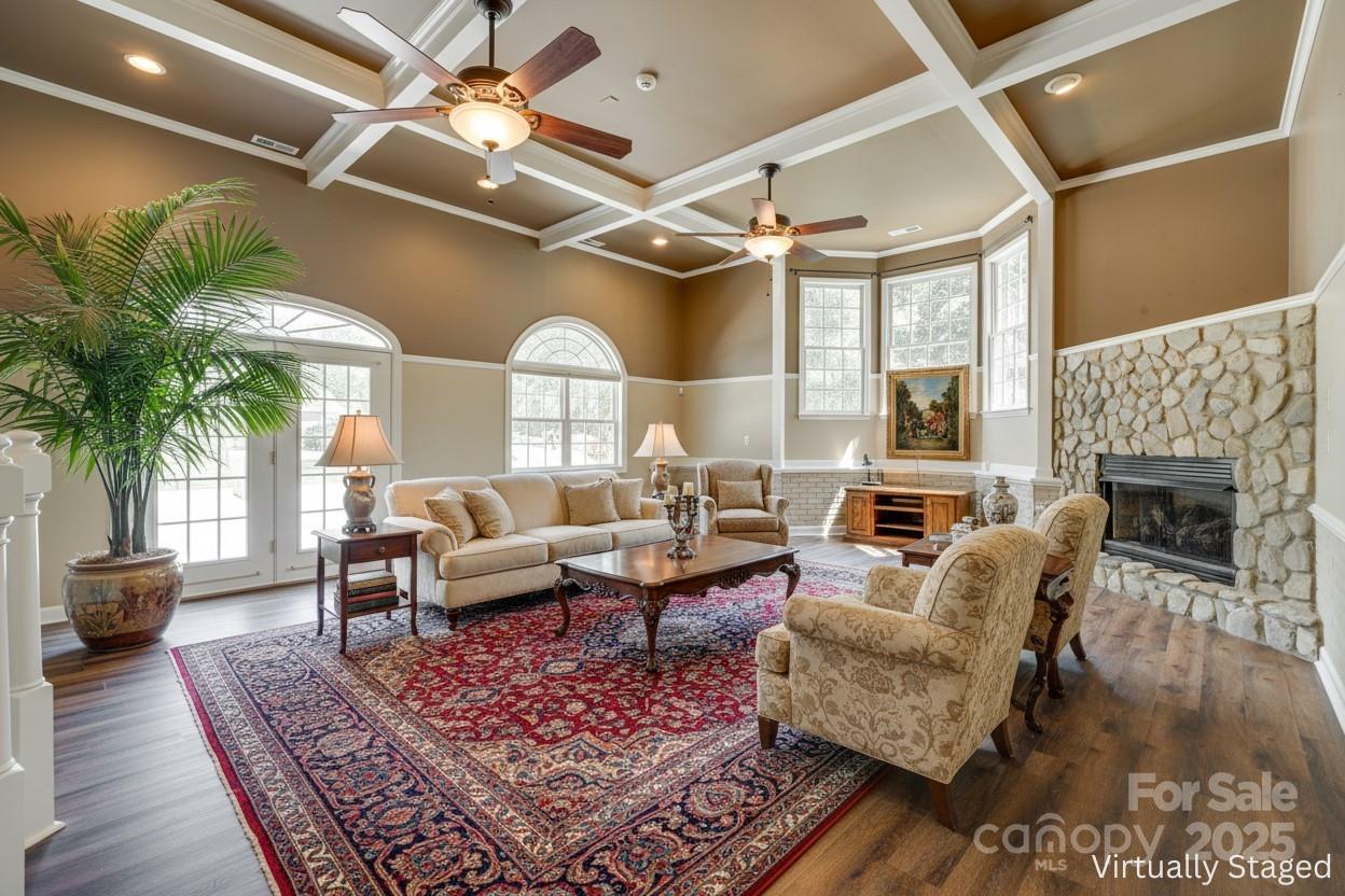 4307 Edgeland Road Edgemoor, SC 29712 - Photo 33 of 48 a living room with furniture a fireplace and a potted plant
