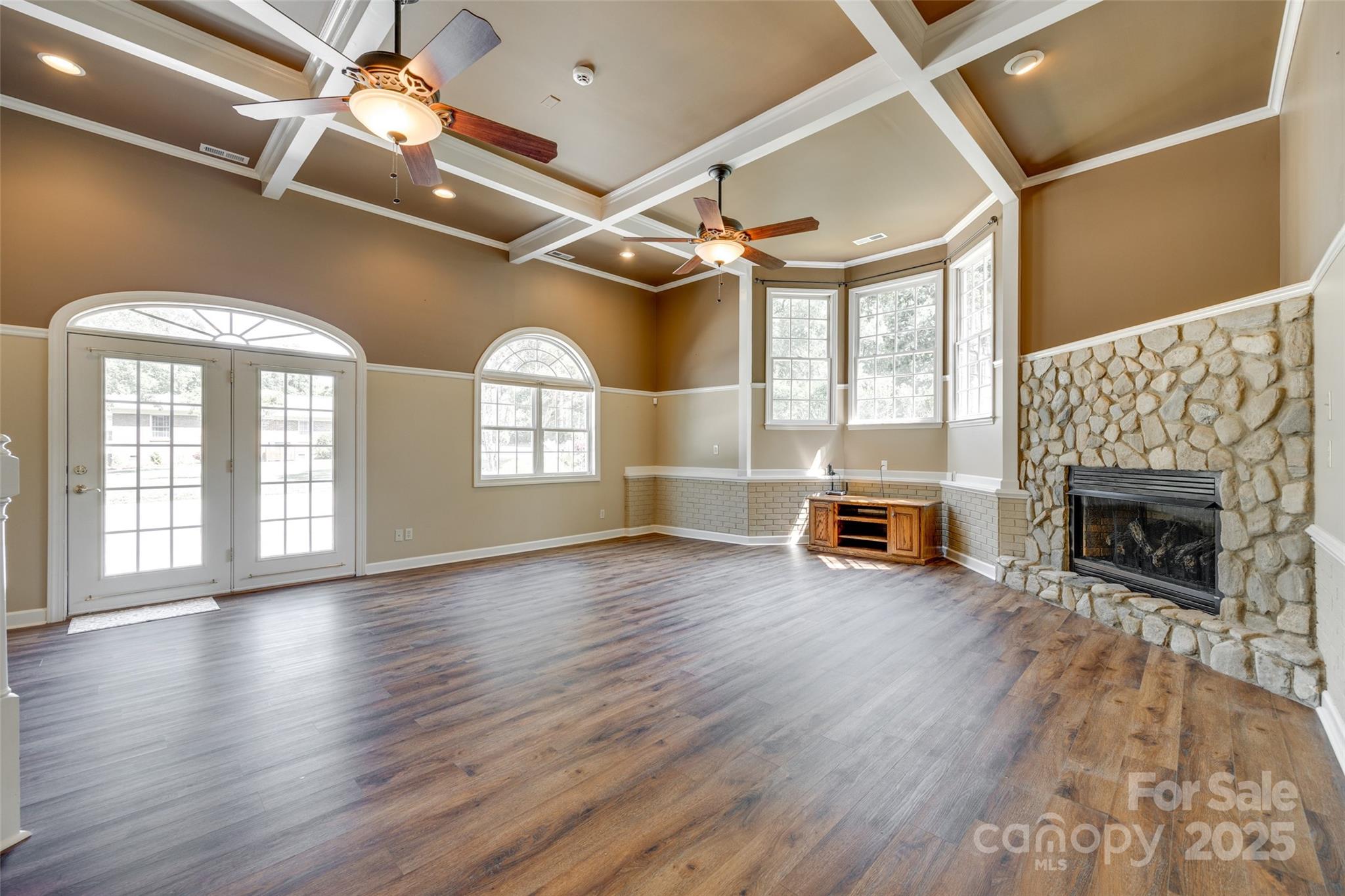 4307 Edgeland Road Edgemoor, SC 29712 - Photo 34 of 48 a view of an empty room with wooden floor fireplace and a window