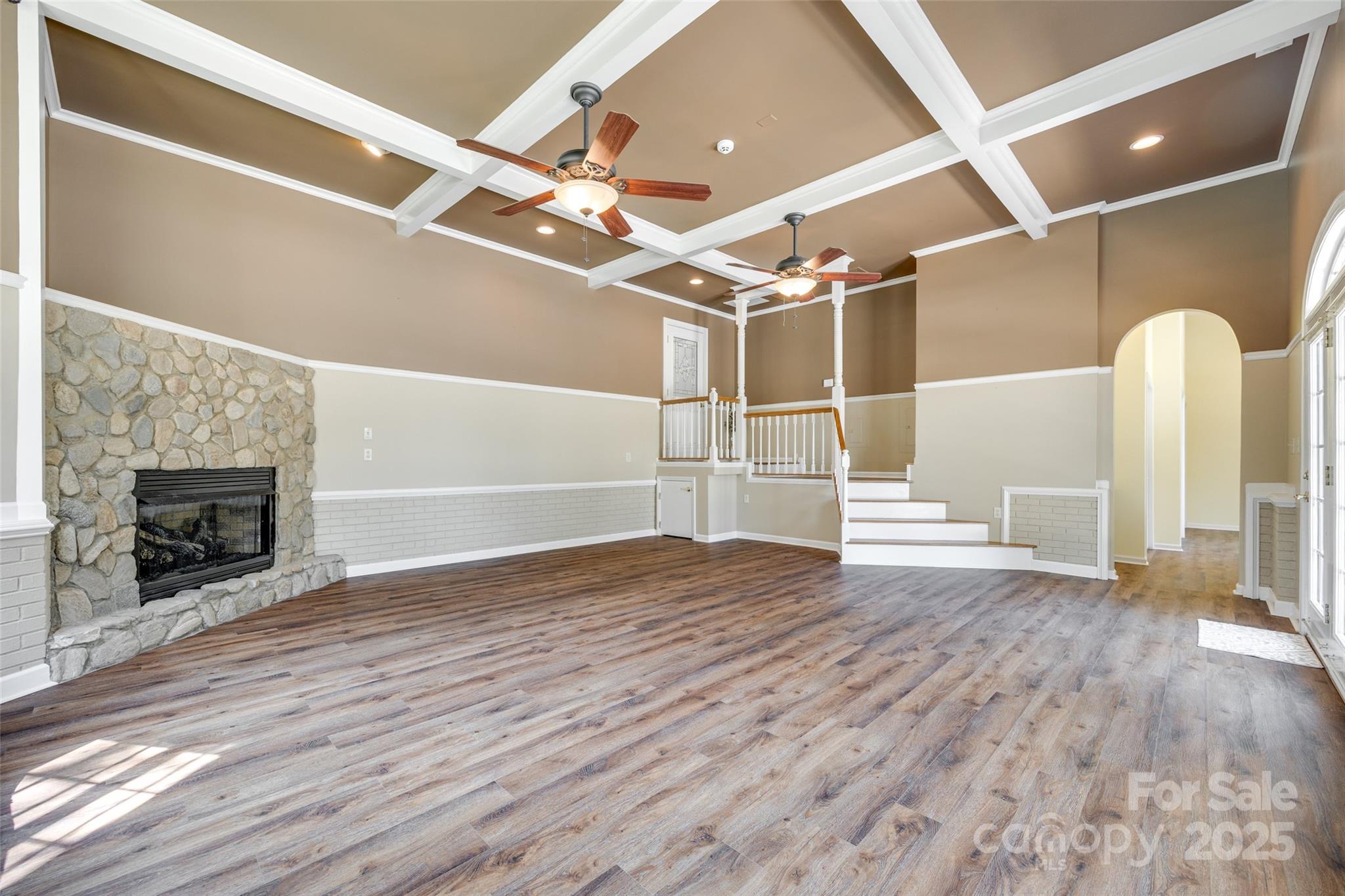 4307 Edgeland Road Edgemoor, SC 29712 - Photo 35 of 48 a view of an empty room with wooden floor and a fireplace