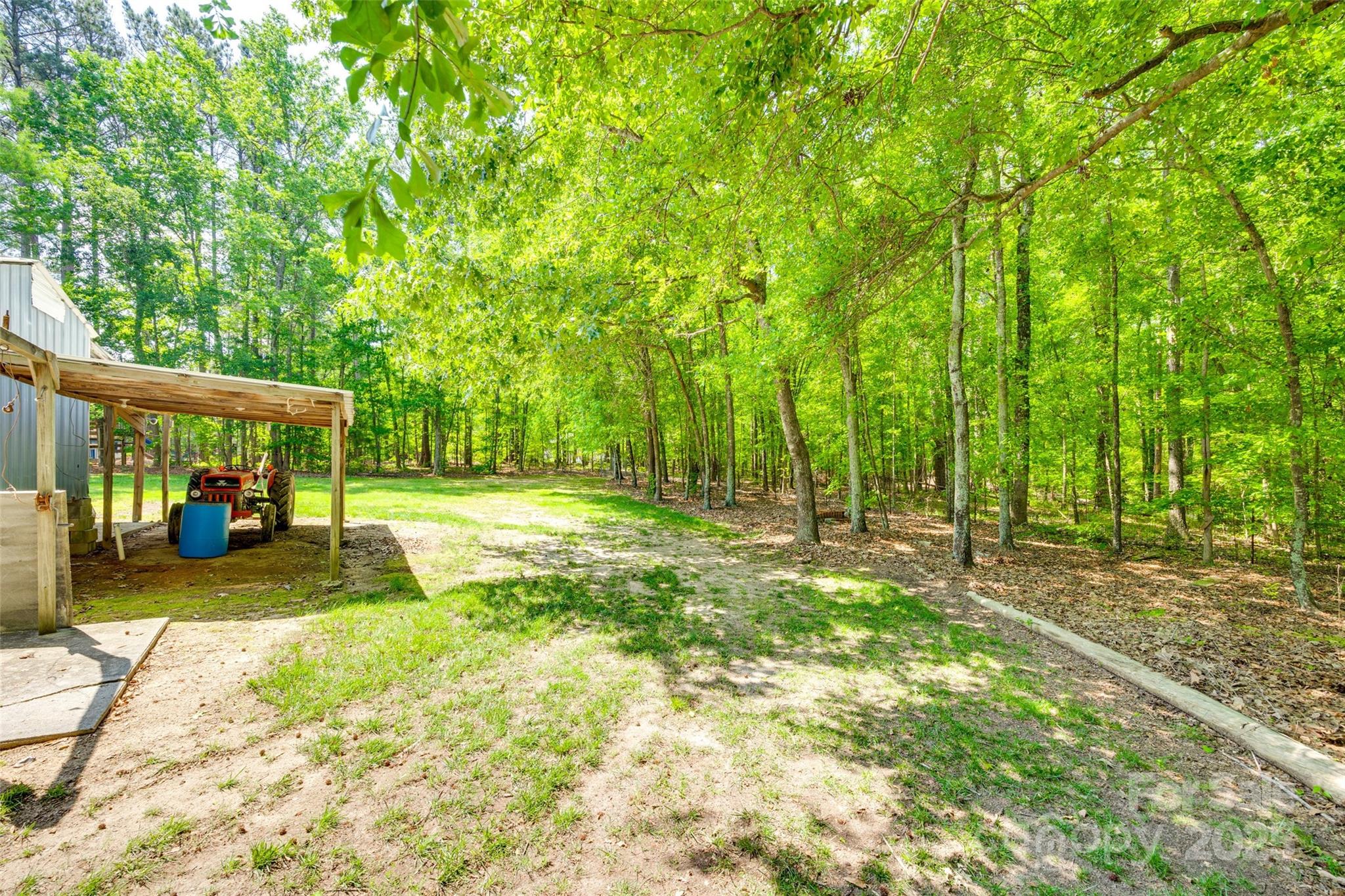 4307 Edgeland Road Edgemoor, SC 29712 - Photo 43 of 48 a view of a house with backyard and sitting area