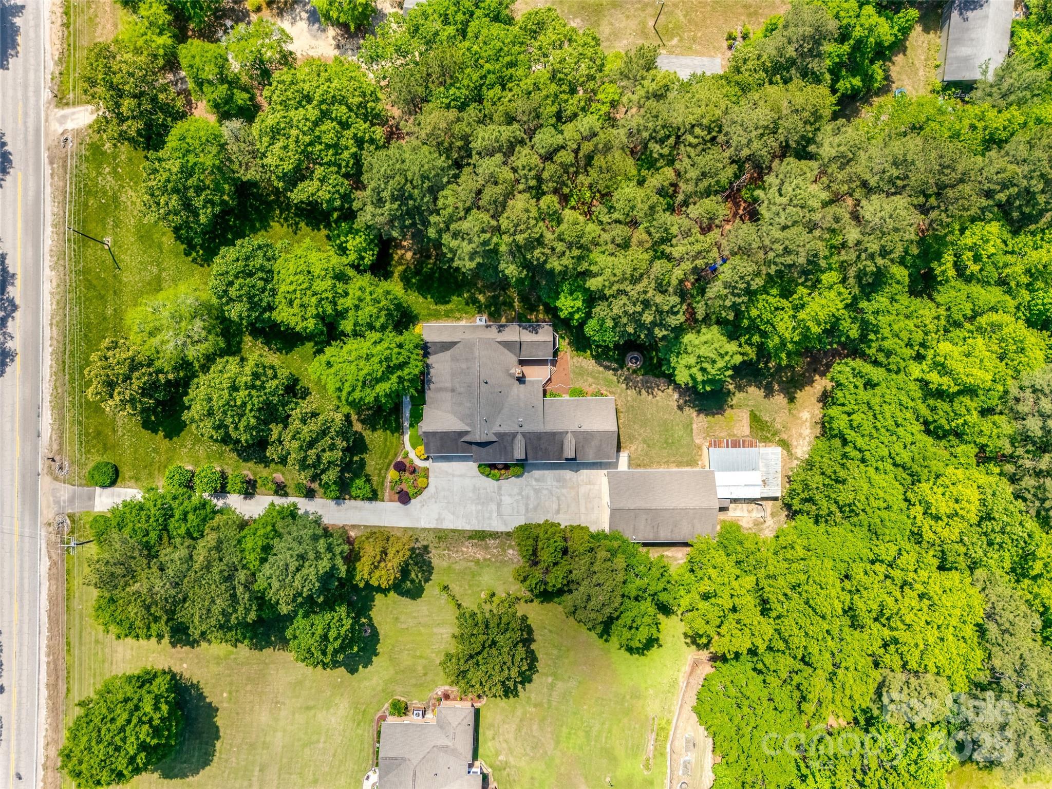 4307 Edgeland Road Edgemoor, SC 29712 - Photo 47 of 48 an aerial view of a house with a yard and trees all around