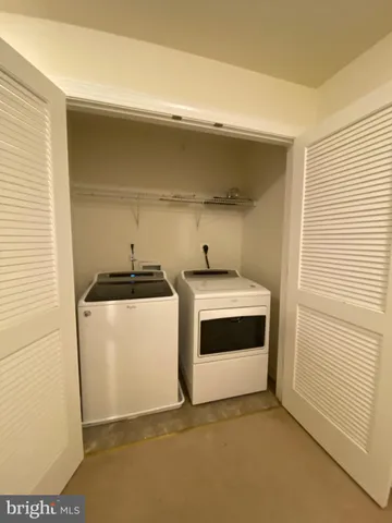 a utility room with washer and dryer