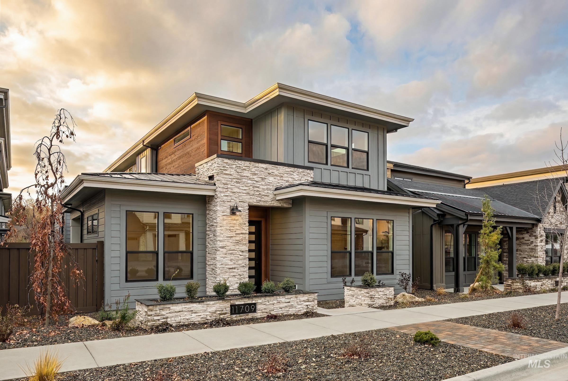 11709 North Rabbitbrush Way Boise, ID 83714 - Photo 1 of 31 Modern home with stone siding and board and batten siding