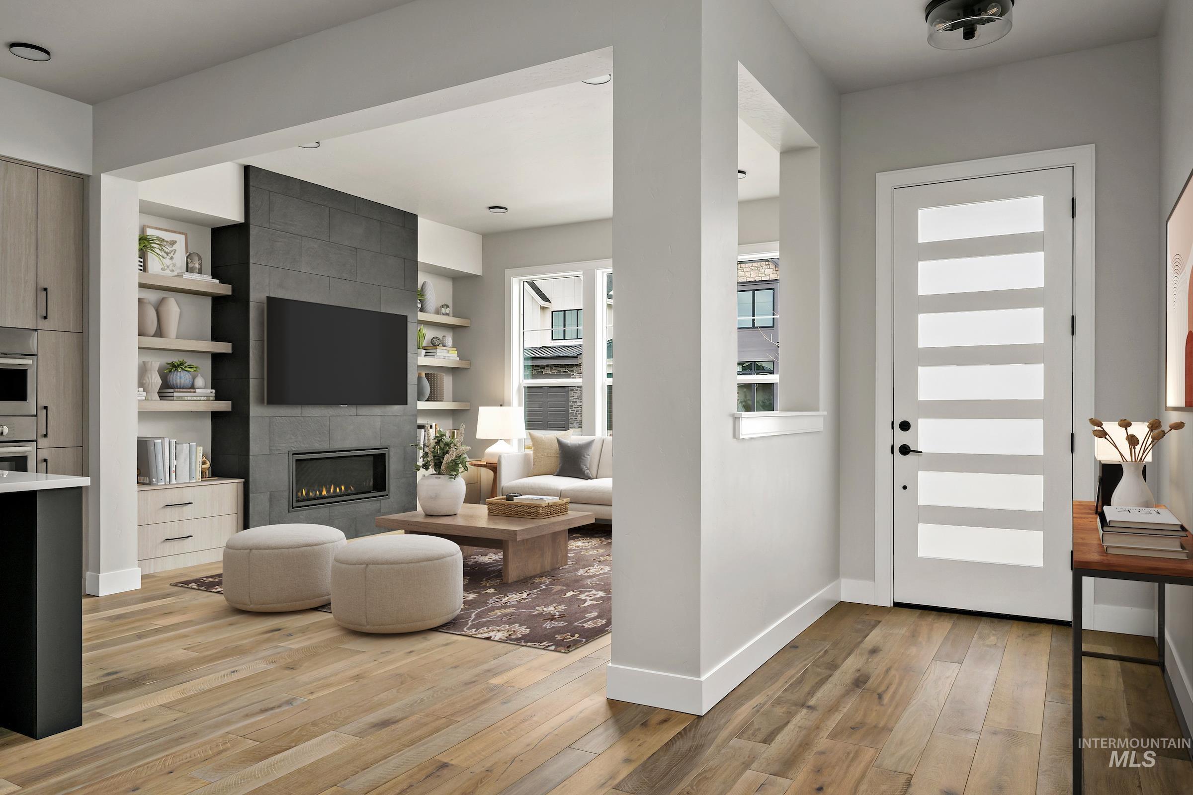 11709 North Rabbitbrush Way Boise, ID 83714 - Photo 12 of 31 Foyer with a tiled fireplace and light wood finished floors