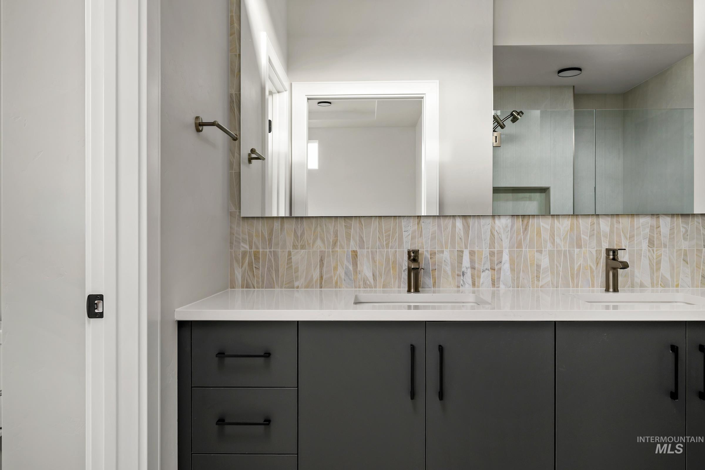 11709 North Rabbitbrush Way Boise, ID 83714 - Photo 23 of 31 Bathroom with double vanity and tasteful backsplash