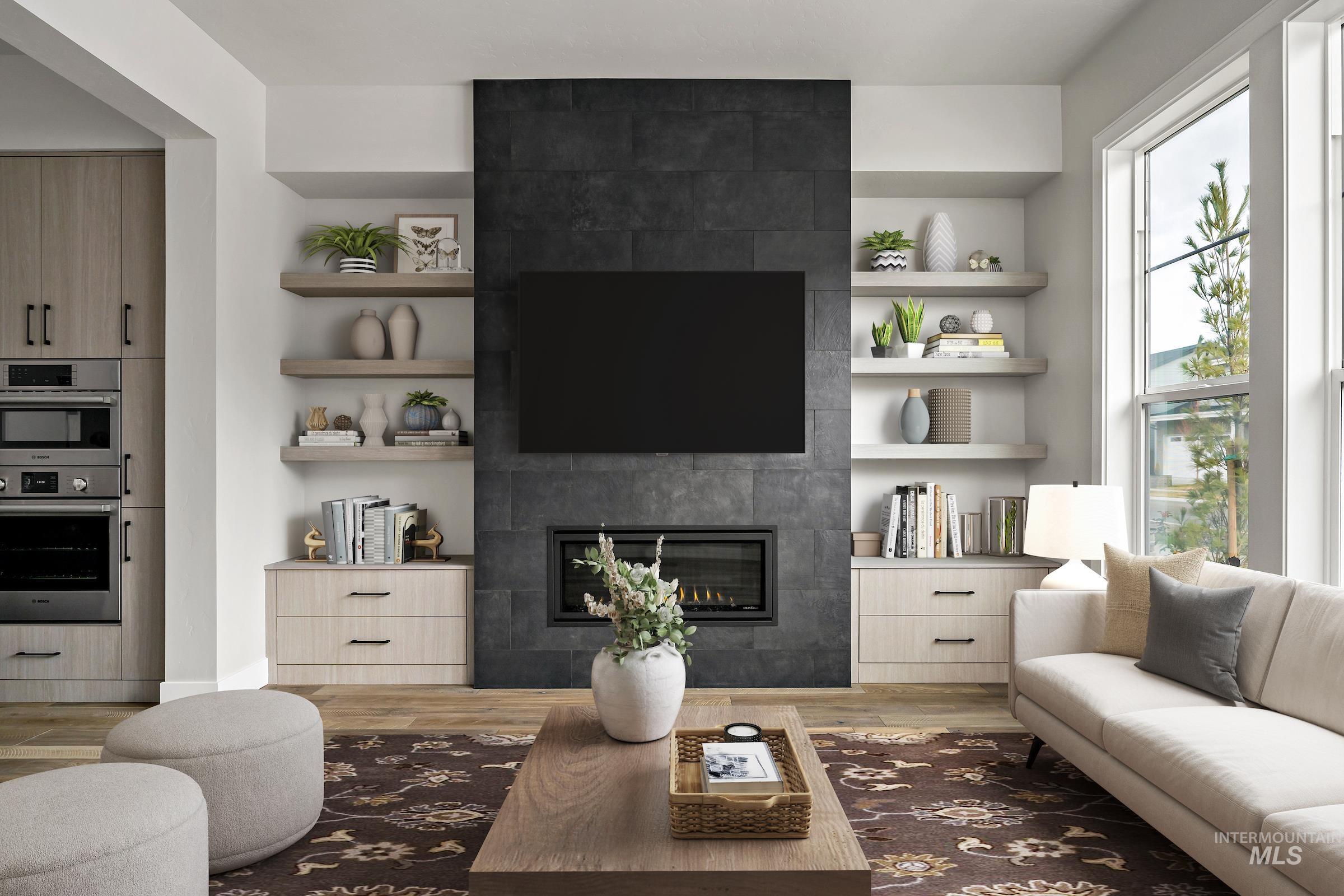 11709 North Rabbitbrush Way Boise, ID 83714 - Photo 4 of 31 Living area with built in features, a tile fireplace, and light wood finished floors