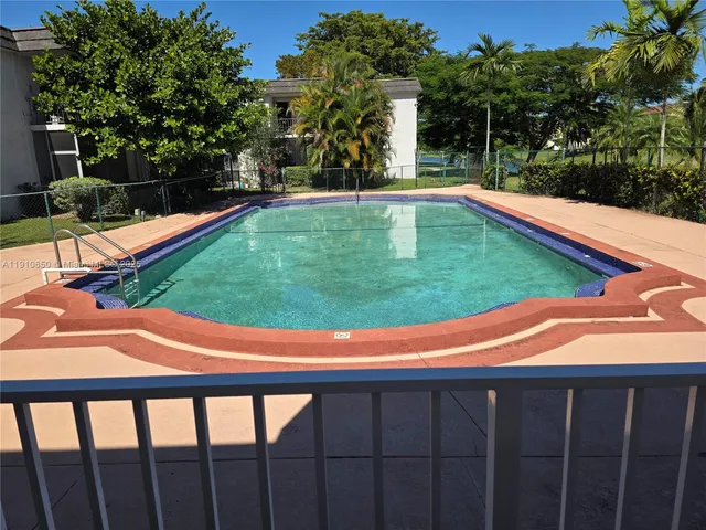 a view of a golf course with a lake view