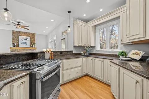 a kitchen with a stove and a kitchen island