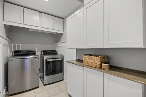 a living room with furniture and a ceiling fan
