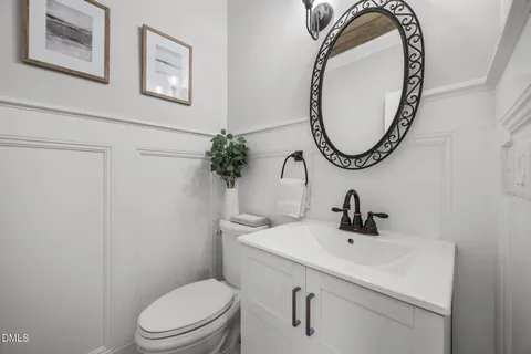 a kitchen with stainless steel appliances granite countertop a refrigerator and a stove